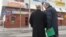 RUSSIA -- Russian President Vladimir Putin (L) and Presidential Envoy of the Siberian Federal District Sergei Menyailo visit the site of fire, that killed at least 64 people at a busy shopping mall, in Kemerovo, March 27, 2018