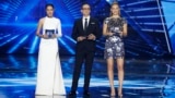 (L to R) Israeli television presenter Lucy Ayoub, Israeli supermodel Bar Refaeli and Israeli television host Erez Tal stand on stage during the first semi-final of the 64th edition of the Eurovision Song Contest 2019 at Expo Tel Aviv on May 14, 2019, in t