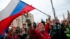 A supporter waves a Russian flag and shouts slogans during the April 21, 2021 rally in Moscow in support of jailed opposition leader Aleksei Navalny..