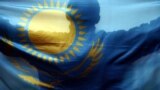 Italy -- A fan holds up the flag of Kazakhstan during their men's ice hockey game against the U.S. at the Torino 2006 Winter Olympic Games in Turin, Italy, February 16, 2006