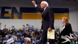 Democratic U.S. presidential candidate Senator Bernie Sanders is accompanied by his wife Jane O’Meara Sanders as he arrives to speak at his New Hampshire primary night rally in Manchester