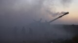 ISRAEL -- Israeli soldiers fire a 155mm self-propelled howitzer towards the Gaza Strip from their position along the border, on May 18, 2021. 