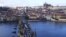 CZECH REPUBLIC – Supporters of Ukraine carry a large Ukrainian flag on the medieval Charles Bridge in Prague, January 22, 2022