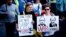 U.K. – One of the posters depicts Russian President Vladimir Putin and Alexander Lukashenko with the inscription "War criminals" at a protest against the Russian invasion of Ukraine. London, 26 March 2022