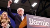 Democratic U.S. presidential candidate Senator Bernie Sanders is accompanied by his wife Jane O’Meara Sanders and other relatives as he speaks at his New Hampshire primary night rally in Manchester