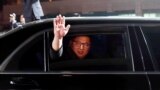 SOUTH KOREA -- North Korean leader Kim Jong Un (inside a vehicle) bids farewell to South Korean President Moon Jae-in as he leaves after a farewell ceremony at the truce village of Panmunjom inside the demilitarized zone separating the two Koreas, South K