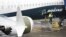 U.S. -- A worker is pictured next to a Boeing 737 MAX 9 airplane on the tarmac at the Boeing Renton Factory in Renton, Washington, March 12, 2019