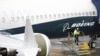 U.S. -- A worker is pictured next to a Boeing 737 MAX 9 airplane on the tarmac at the Boeing Renton Factory in Renton, Washington, March 12, 2019