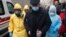 UKRAINE -- Ukrainian medical workers wearing protective gear escort a fake patient during a medical training exercise in case of detection of patients with the COVID-19 coronavirus symptoms, at the Oleksandrivska Clinical Hospital in Kyiv, February 28, 20