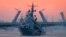 RUSSIA -- A warship floats past drawbridges rising above the Neva River during preparations for the Naval parade in St. Petersburg, July 20, 2020