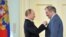 Russia -- President Vladimir Putin (L) hands over a "Hero of Labour" award to Mariinsky theatre director Valery Gergiev, 1May2013