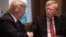 (FILES) In this file photo taken on April 9, 2018, US President Donald Trump shakes hands with National Security Advisor John Bolton during a meeting with senior military leaders at the White House in Washington, DC.
