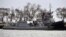 UKRAINE -- A Ukrainian warship and a tugboat stand in a port in the Crimean city of Kerch after they were captured by the Russian Border Guard Service and escorted there, November 26, 2018