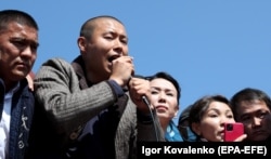 Businessman Tilek Toktogaziev, second from the left, addresses supporters at a gathering in Bishkek on October 7, 2020.