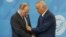 Президент Узбекистана Ислам Каримов поправляет костюм президенту России Владимиру Путину. Саммит ШОС, Уфа, июль 2015