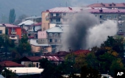 Smoke rises after shelling by Azerbaijan's artillery on Stepanakert (Khankendi), the main town in the breakaway region of Nagorno-Karabakh, on November 4, 2020.