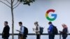 (FILES) In this file photo taken on October 4, 2017, people wait to enter a Google product launch event on at the SFJAZZ Center in San Francisco, California.