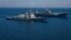 AT SEA -- The U.S. Navy Arleigh Burke-class guided-missile destroyer USS Porter and the Blue Ridge-class command and control ship USS Mount Whitney sail in formation during the U.S.-Ukraine multinational maritime exercise Sea Breeze 2018 in the Black Sea 