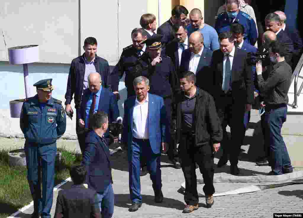 The head of the Emergency Situations Ministry in Tatarstan, Rafis Khabibullin (left), and the president of Russia&#39;s autonomous Republic of Tatarstan, Rustam Minnikhanov (center), arrive at Kazan&#39;s School No. 175 on May 11, 2021. Minnikhanov has described the shooting as &quot;a major tragedy for our republic.&quot;&nbsp;