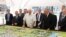  BELARUS -- Belrusian President Alyaksandr Lukashenka (center) visits the Belarusian Biotechnological Corporation with a man (holding the pointer) who looks like Kyrgyzstan's wanted former prime minister, Daniyar Usenov, August 10, 2020
