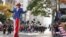 New York, U.S. - A man dressed as Uncle Sam reacts to a member of the crowd during the Veterans Day Parade in Manhattan