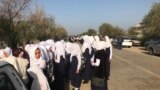 Kazakhstan - Schoolgirls, who wear shawl, stay in front of school.Ferdausi village, Turkestan region, 5September2018 