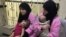 IRAQ -- Two Russian nationals attend her trial at the Central penal Court in Baghdad, April 17, 2018