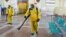 RUSSIA -- Specialists wearing personal protective equipment (PPE) spray disinfectant while sanitizing the Rizhsky Railway Station, one of the measures to curb the spread of the coronavirus disease (COVID-19), in Moscow, June 17, 2021