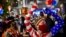Supporters of former Vice President Joe Biden celebrate in Philadelphia, Pennsylvania on November 7, 2020 after the prognosis that Biden has received sufficient Electoral College votes to become president of the United States.