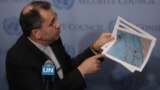 New York, U.S. - Iranian Ambassador to the United Nations Majid Takht-Ravanchi / Iranian Ambassador to the United Nations Majid Takht-Ravanchi shows maps of airspace to the media outside Security Council chambers at the U.N. headquarters in New York, U.S.