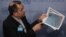 New York, U.S. - Iranian Ambassador to the United Nations Majid Takht-Ravanchi / Iranian Ambassador to the United Nations Majid Takht-Ravanchi shows maps of airspace to the media outside Security Council chambers at the U.N. headquarters in New York, U.S.