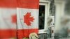 Минчанин получил 15 суток за канадский флаг в окне