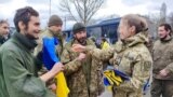 Ukrainian POWs are seen after swap at unknown location in Ukraine