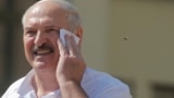 BELARUS -- Belarusian President Alyaksandr Lukashenka wipes his face as he addresses his supporters gathered on Independent Square of Minsk, August 16, 2020