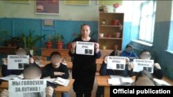 A teacher and her students show their support for President Vladimir Putin.