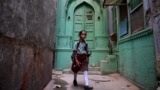 INDIA -- An Indian school girl walks in an alley in the old quarters of New Delhi, November 28, 2018