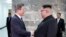South Korean President Moon Jae-in shakes hands with North Korean leader Kim Jong Un during their summit at the truce village of Panmunjom, North Korea, in this handout picture provided by the Presidential Blue House on May 26, 2018.
