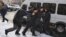 Полицейские задерживают участников митинга в Алматы. 16 декабря 2019 года.