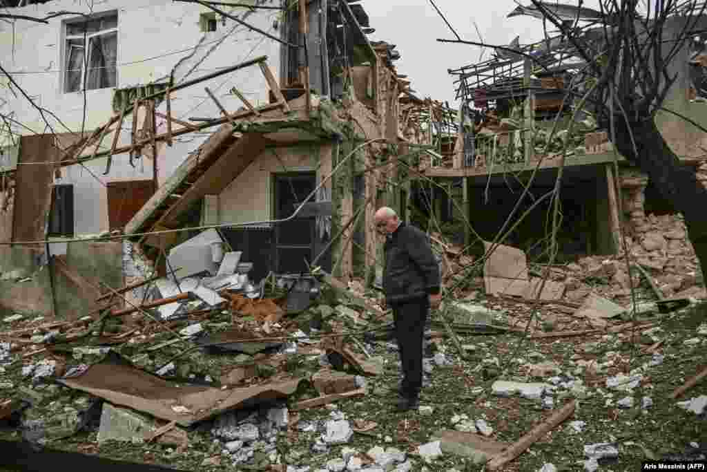 An elderly man stands in front of a destroyed house after shelling on the main Karabakhi town of Stepanakert (Khankendi) on October 7, 2020. For many of Karabakh&#39;s residents, the fighting is a repeat of the violence they experienced in the early 1990s, when sporadic fighting between Azerbaijanis, Armenians, and Armenia-backed Karabakhis led to full-scale war.&nbsp;&nbsp;