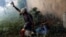 -- An injured demonstrators is been helped by another protester after clashing with riot police during the so-called "mother of all marches" against President Nicolas Maduro in Caracas, April 19, 2017