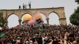 ISRAEL - Palestinians react at the compound that houses Al-Aqsa Mosque, known to Muslims as Noble Sanctuary and to Jews as Temple Mount, in Jerusalem's Old City May 21, 2021.