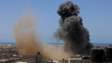 PALESTINE -- Smoke billows from a building targeted during an Israeli airstrike in Rafah in the southern Gaza Strip on May 20, 2021. - Israel and the Palestinians are mired in their worst conflict in years as Israel pounds the Gaza Strip with air strikes 