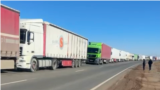 Kazakhstan – Trucks waiting in line at the border of Kazakhstan and Russia. Kurmangazy station.