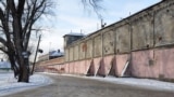 The road along the walls of the prison during the winter. Russia
