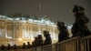 RUSSIA -- Russian law enforcement officers stand guard behind barriers in Palace Square in central Saint Petersburg, Russia February 2, 2021.