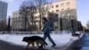 RUSSIA - Police officers with dogs patrol outside the Babushkinsky district court during the trial of Russian opposition leader Alexei Navalny, charged with defaming a World War II veteran, in Moscow on February 5, 2021