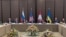 This handout photograph taken and released by the National Security and Defense Council of Ukraine (NSDC) press office on February 17, 2026, shows the US delegation waiting for the start of a meeting on the first day of the third round of trilateral talks