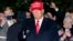 U.S. -- President Donald Trump gestures as he walks on the South Lawn of the White House in Washington, Tuesday, Nov. 3, 2020, after stepping off Marine One and greeting supporters. Trump is returning from campaign events in North Carolina, Pennsylvania, 
