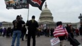 U.S. -- Supporters of US President Donald Trump hold a rally outside the US Capitol as they protest the upcoming electoral college certification of Joe Biden as US President in Washington, DC on January 6, 2021.