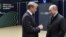 Russia -- Sberbank CEO and Chairman of the Executive Board German Gref (L) and Russia's President Vladimir Putin